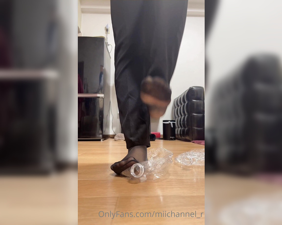 Miichannel_r aka Miichannel_r OnlyFans - A woman in a pantsuit tramples a bottle 1