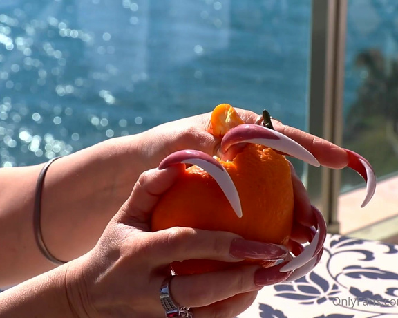 Lora Long Nails aka Loralongnails OnlyFans - Crushing an orange with long claws