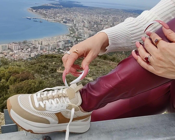 Lora Long Nails aka Loralongnails OnlyFans - Im sitting on a roadside barrier high up in the mountains overlooking the city, wearing burgundy