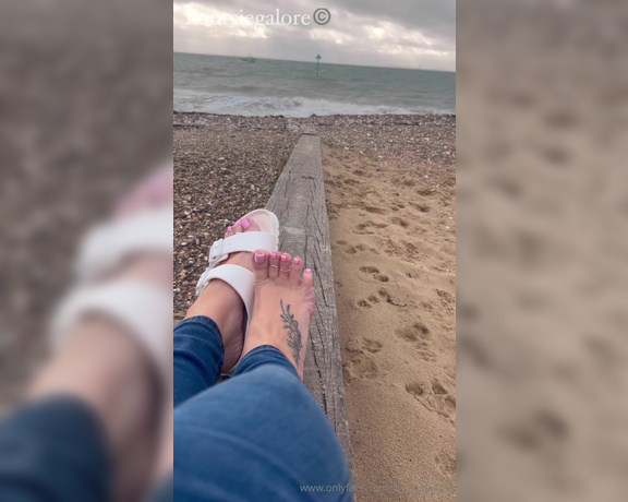 Footsie Galore aka Footsiegalore OnlyFans - Just sitting by the beach in my Birks, it’s so cold though Would you warm my feet for