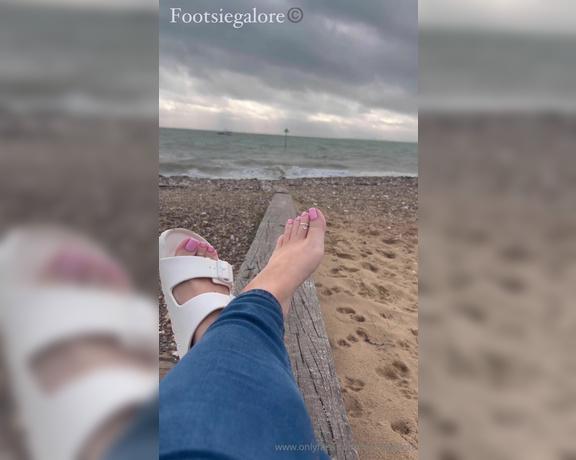 Footsie Galore aka Footsiegalore OnlyFans - Just sitting by the beach in my Birks, it’s so cold though Would you warm my feet for