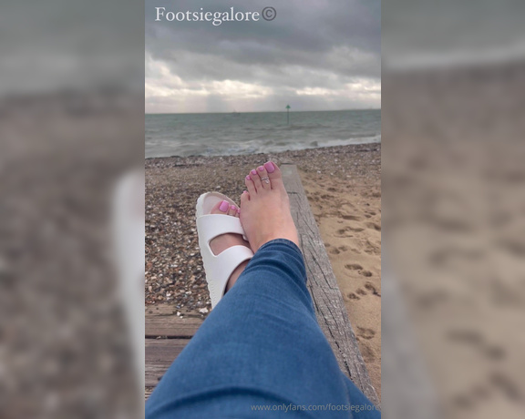 Footsie Galore aka Footsiegalore OnlyFans - Just sitting by the beach in my Birks, it’s so cold though Would you warm my feet for