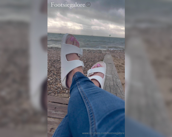 Footsie Galore aka Footsiegalore OnlyFans - Just sitting by the beach in my Birks, it’s so cold though Would you warm my feet for