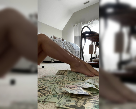 Princess Emma aka worship_emma OnlyFans - 2 minute clip rubbing lotion on my feet and legs over a huge pile of cash