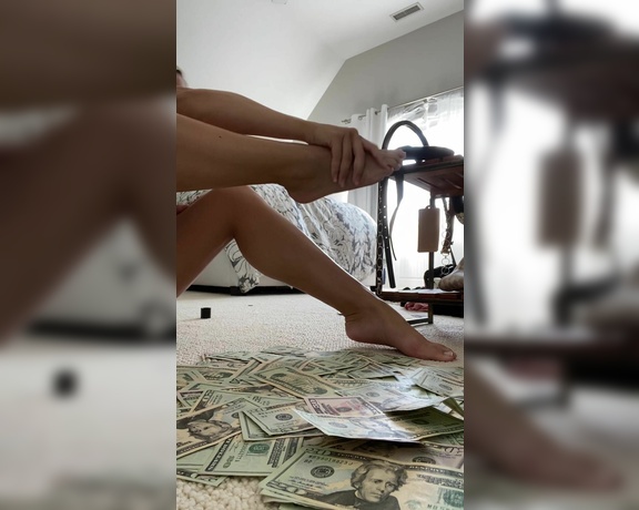 Princess Emma aka worship_emma OnlyFans - 2 minute clip rubbing lotion on my feet and legs over a huge pile of cash