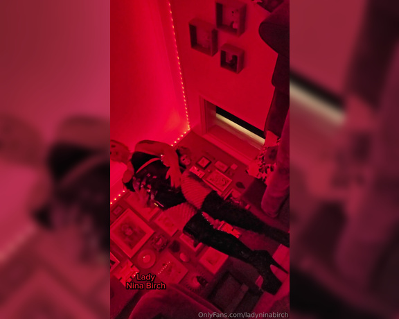 Lady Nina Birch aka ladyninabirch Findom - 03-16-2024 OnlyFans Video - Mistress towering over you, shrouded by moody, red lighting in shiny thigh boots and latex